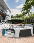 An AquaRest Spas Daydream 3500S Hot Tub sits on a deck in a backyard
